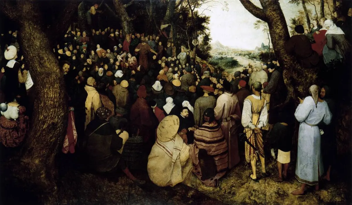 Wide painting of a great crowd of townspeople, peasants and travelers gathered in a forest clearing, listening to John the Baptist preaching in the middle distance beside a river