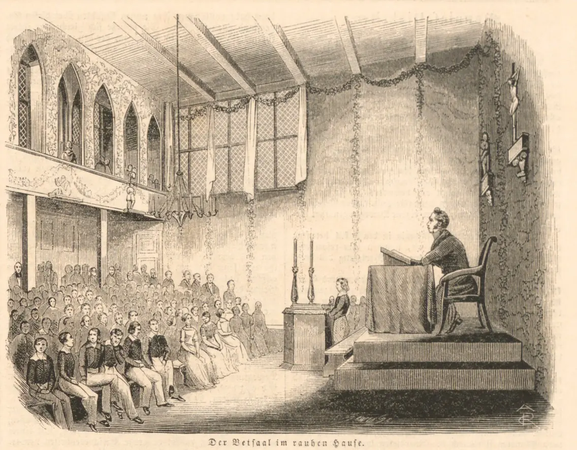 Wood engraving of a long prayer hall with garlands on the walls, rows of boys on benches and a man seated at a raised desk teaching