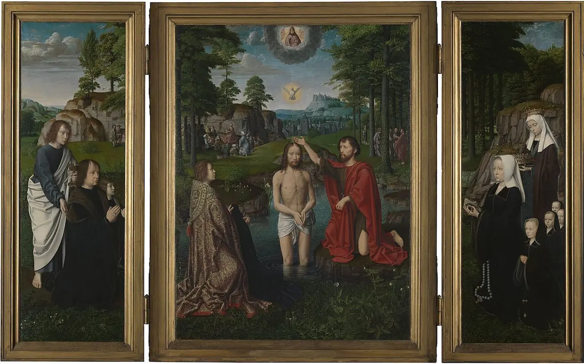 Open Flemish triptych with Christ standing in a clear stream as John baptizes him and an angel holds his red robe in the center, God the Father and the dove above, and the kneeling donor family with their patron saints on the wings