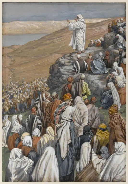 Watercolor of Jesus in white standing on a rocky outcrop with arms raised, addressing a vast crowd in white and striped robes that covers the hillside down to the lake