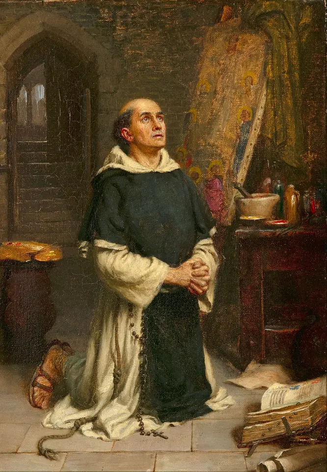 Painting of a Dominican friar in a white habit and black scapular kneeling in his studio with hands joined and eyes raised, an easel, brushes and pots of color around him