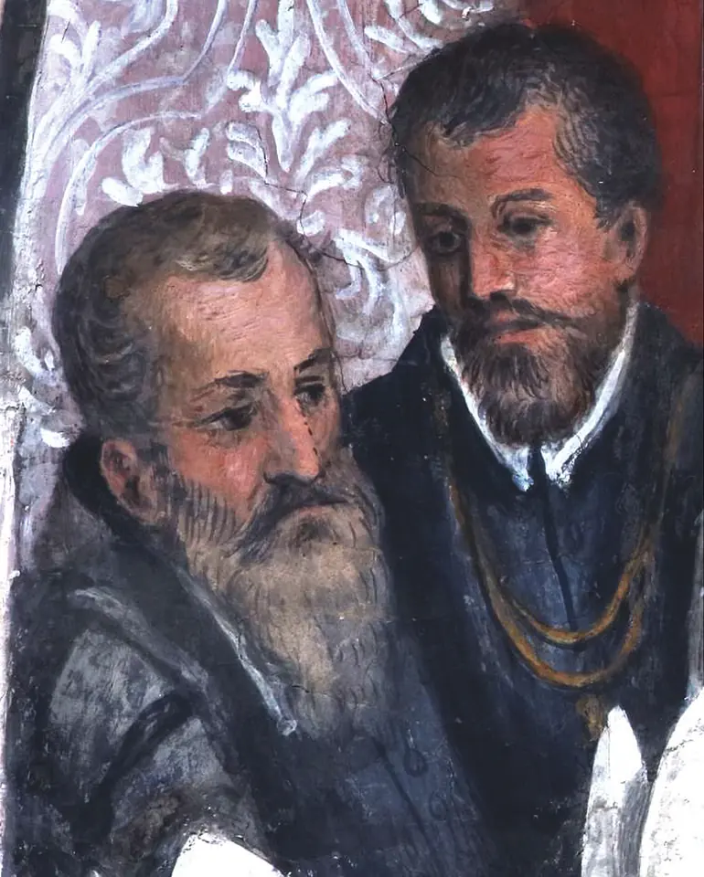 Detail of a fresco showing two bearded men in dark clothes, the older one gray-bearded, standing among a crowd at a ceremony
