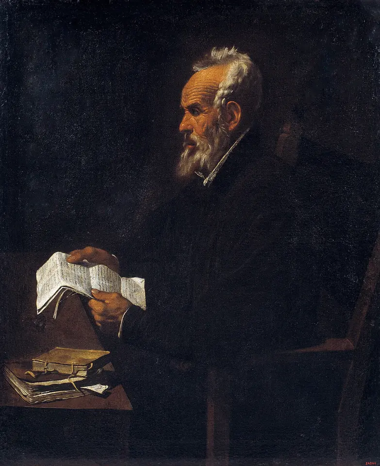 Painting of an old man with a white beard in a dark robe, seen in profile at a table, holding open papers, with books beside him