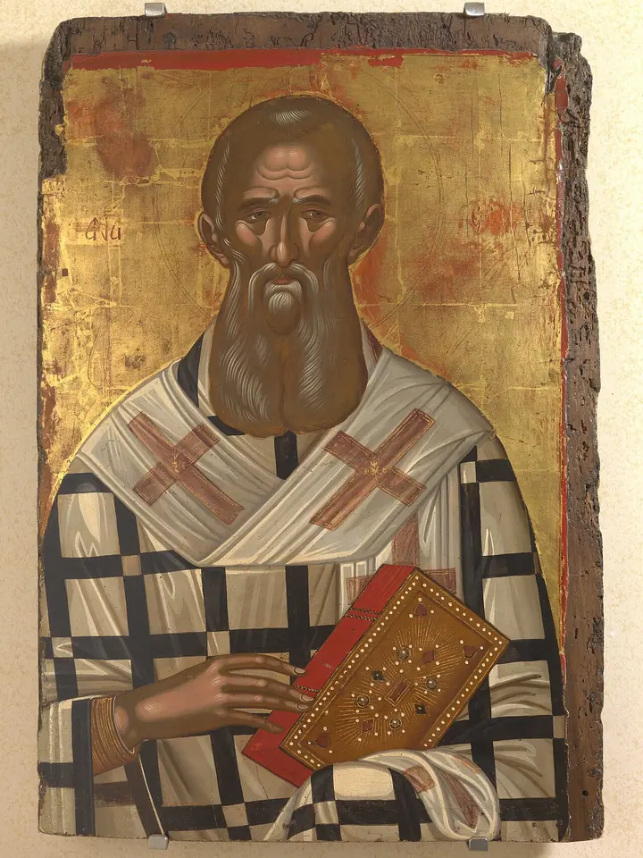 Cretan icon of St. Athanasius with a long dark beard, in a white bishop's vestment with black crosses, holding a red jeweled Gospel book
