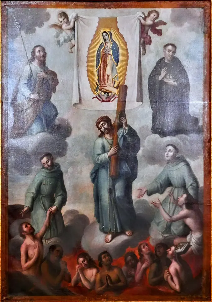 Pintura novohispana con la imagen de la Virgen de Guadalupe en lo alto sostenida por ángeles, Cristo con la cruz en el centro entre frailes franciscanos y otros santos, y abajo las ánimas entre llamas que levantan los brazos