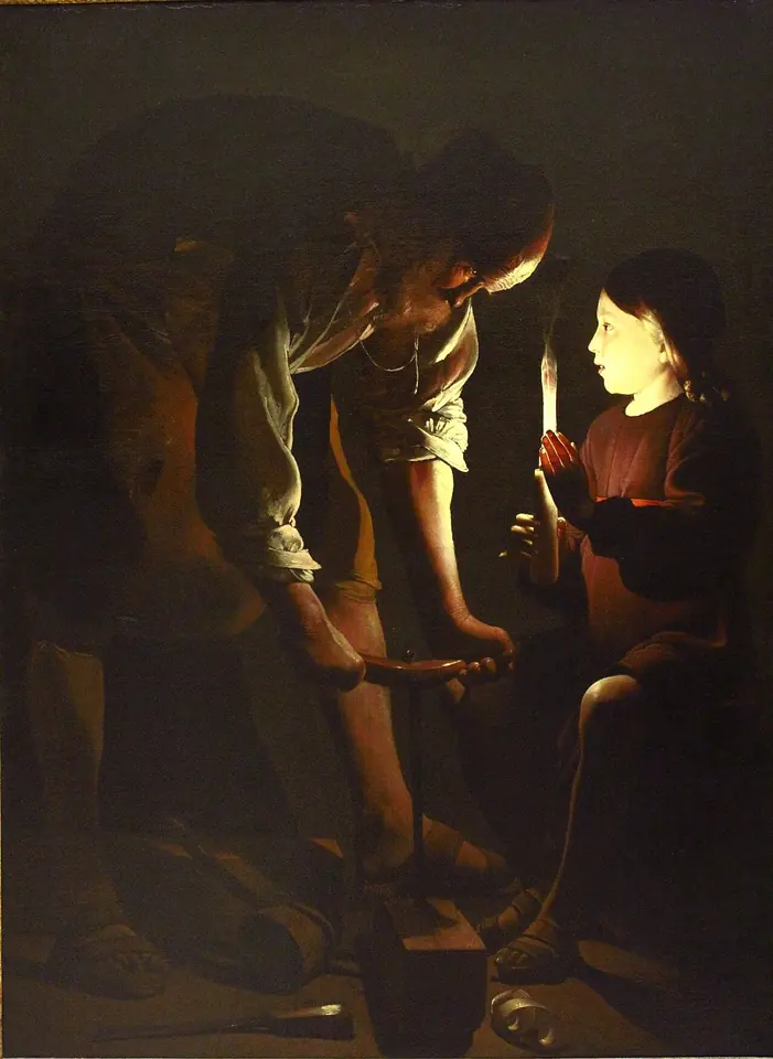 San José, anciano, inclinado sobre una viga que perfora con una barrena, mientras el Niño Jesús sostiene una vela que ilumina los rostros de los dos en el taller oscuro