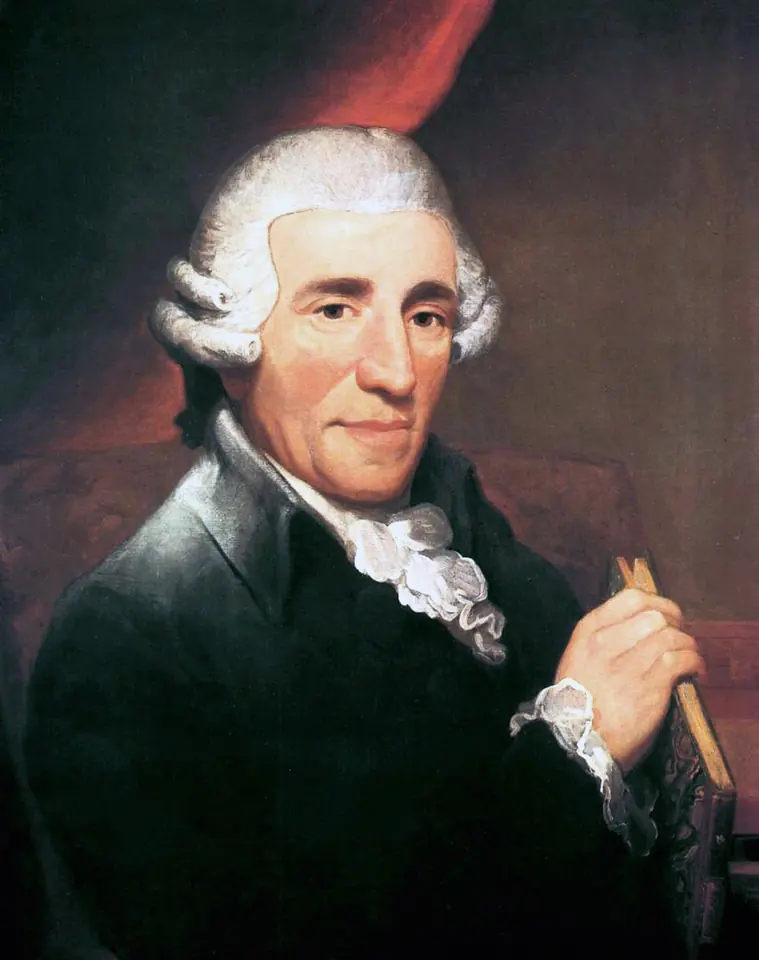 Retrato al óleo de Joseph Haydn, un hombre de unos sesenta años con peluca blanca empolvada, casaca oscura y corbata blanca, con un lápiz en la mano, sobre un fondo rojo oscuro