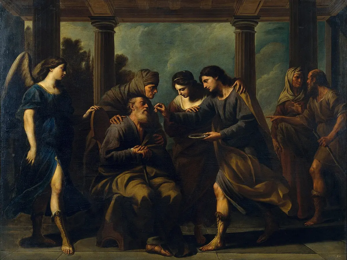 Baroque painting of young Tobias touching the eyes of his old seated father while the winged angel Raphael stands at the left and the family looks on