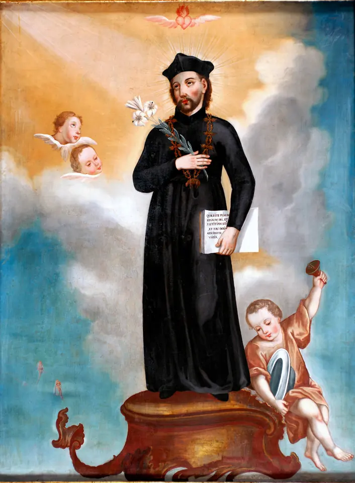 Colonial painting of St. Cajetan in a black cassock holding a lily and a book, standing on a pedestal with clouds and cherubs around him