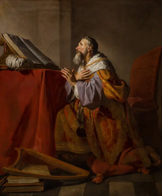 An old bearded King David in an ermine-trimmed robe kneels with his hand on his breast and his eyes raised, an open book on a table beside him and a harp at his feet