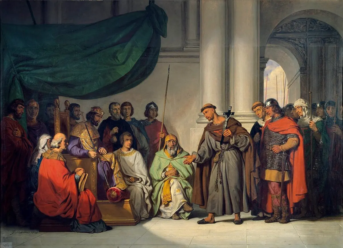 A large 19th-century painting of a Byzantine emperor seated under a green canopy among courtiers in rich robes, receiving a brown-robed hermit who gestures as he speaks