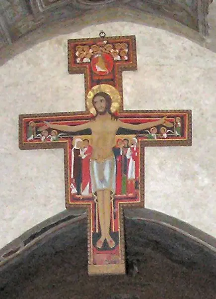 A painted wooden crucifix in the Byzantine style, with Christ's arms outstretched and small figures of Mary, John and others painted beside him