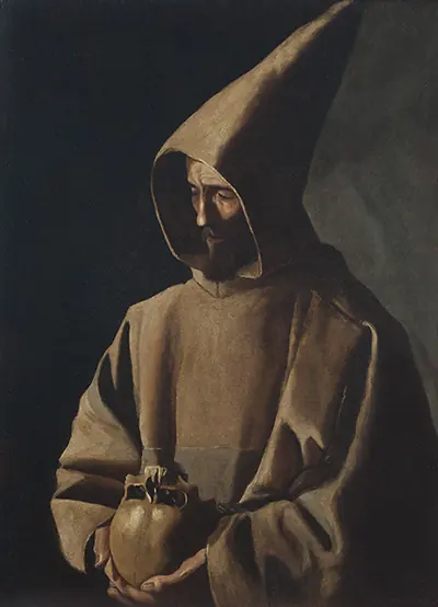 St. Francis in a hooded brown habit stands against a dark background, his face half in shadow, holding a skull against his chest