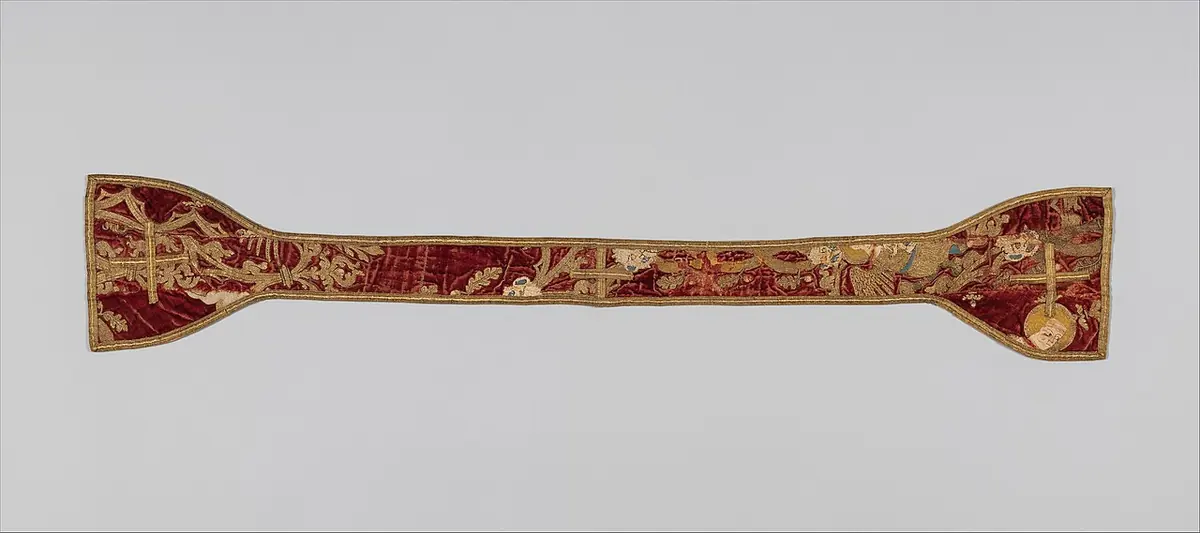 A long narrow band of red silk embroidered with gold and colored figures, widening at both ends into squared flaps