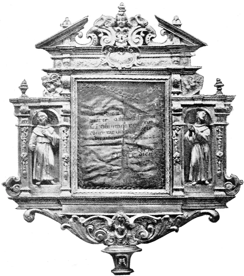 Old black-and-white photograph of an ornate carved reliquary frame with small statues of two friars in side niches, holding a creased parchment with lines of medieval handwriting