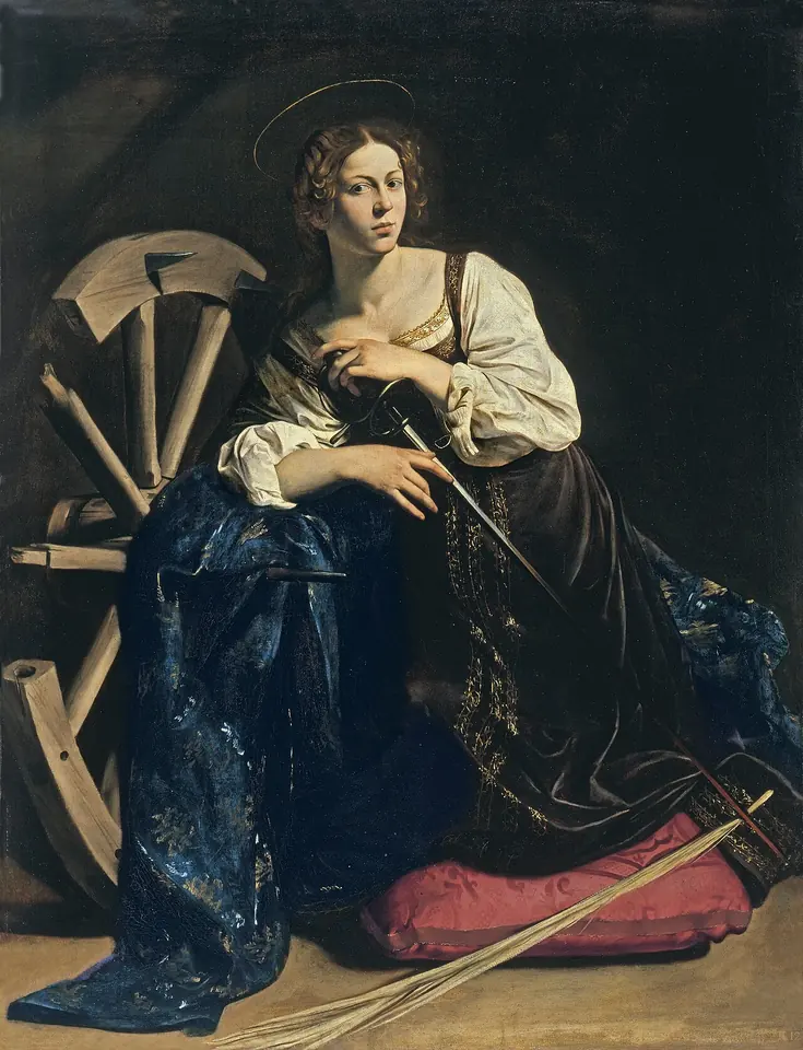 Caravaggio's young Catherine kneeling on a red cushion in a dark room, dressed in rich black and white silks, one hand resting on a sword and her arm against a broken wooden wheel with spikes