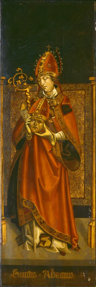 Tall Gothic altar panel of a saint in a red cope and a jeweled miter standing before a gold brocade hanging, holding his own crowned head in his hands