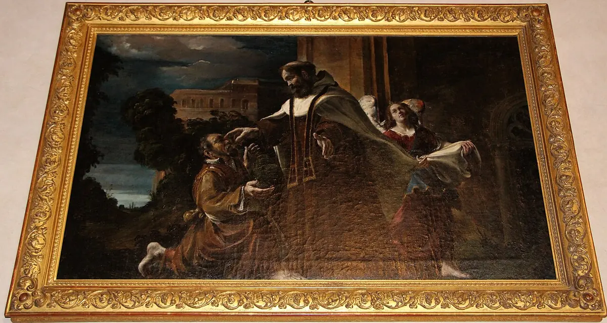 Dark Baroque painting in a gilded frame of a friar bending over a kneeling blind man and touching his eyes, with onlookers behind