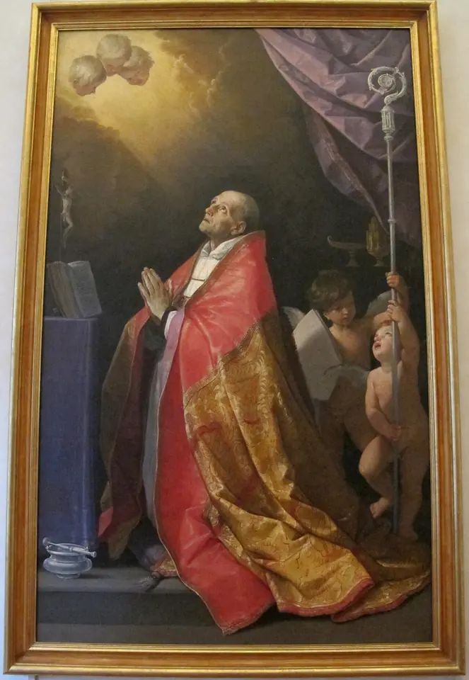 Painting of a kneeling bishop in a red cope gazing upward toward a light in the clouds, as a small angel holds his crozier and an open book