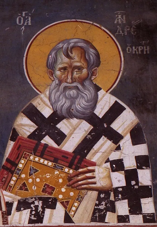 Fresco of a bishop with gray hair and a full gray beard in a white robe with black crosses, holding a richly bound red book, with a Greek inscription