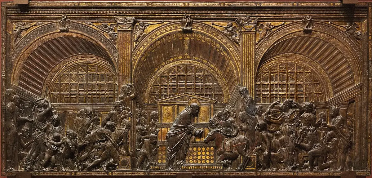 Partly gilded bronze relief under three great arches, with a crowd pressing around a friar who holds up the Host as a mule kneels before him