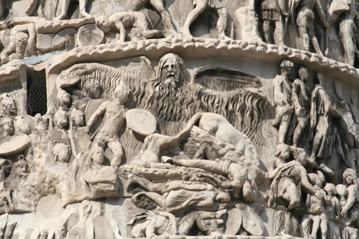 Marble relief from the Column of Marcus Aurelius showing a great winged, bearded rain spirit spreading his arms above Roman soldiers, with water streaming down over men and horses