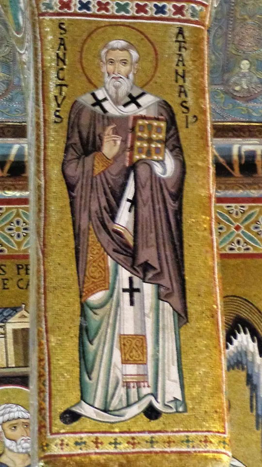 Gold mosaic of a standing bishop labeled Sanctus Athanasius in Latin, in a brown chasuble and white pallium with black crosses, holding a book