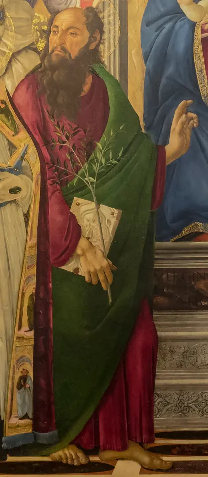 Detail of Botticelli's altarpiece showing a bearded St. Barnabas in a red robe and green cloak, holding a book and a small olive branch