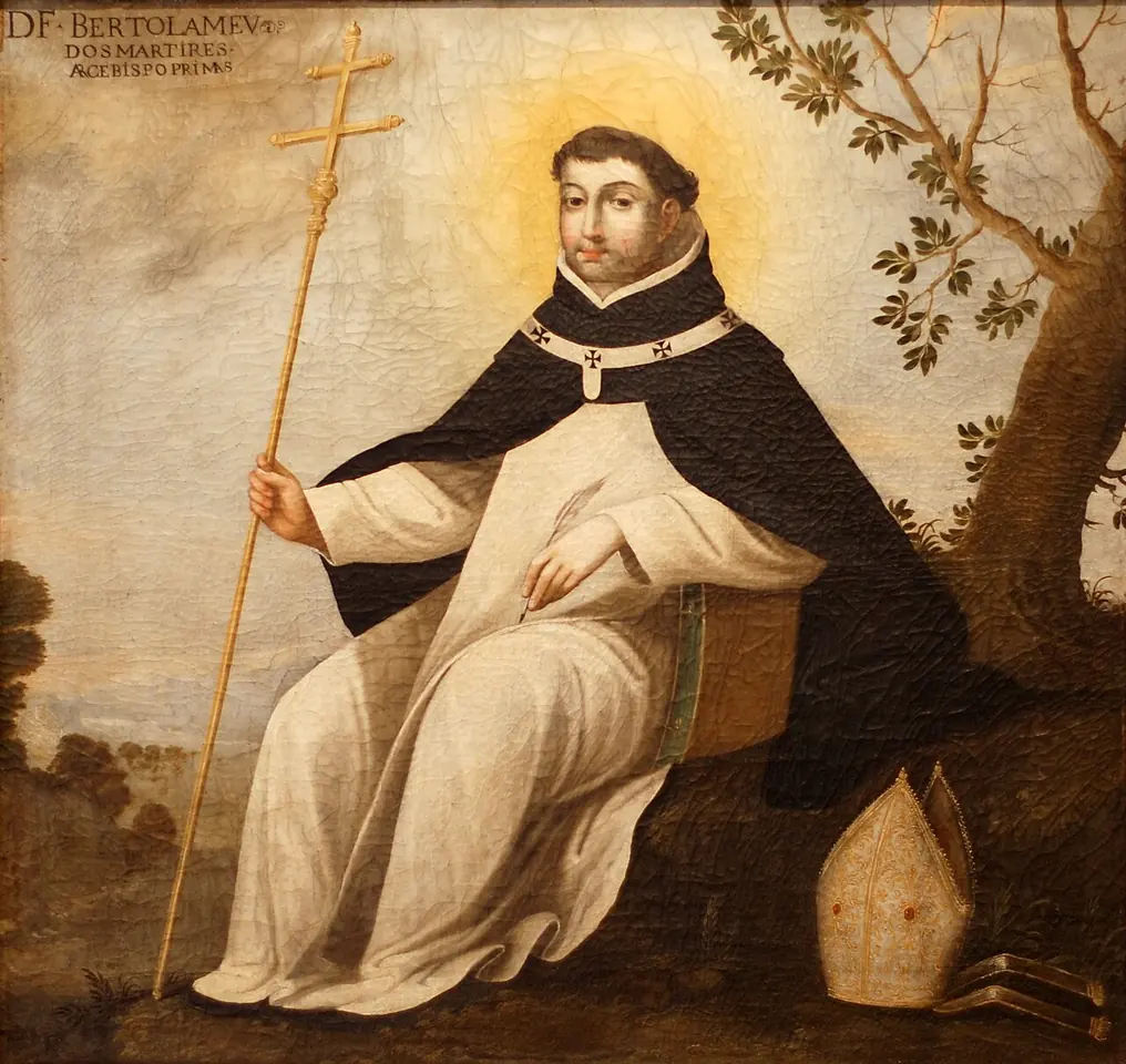 Painting of a Dominican friar in a white habit and black cloak seated beneath a tree, holding a tall double-barred cross, with a white miter on the ground beside him and an inscription naming him at the top
