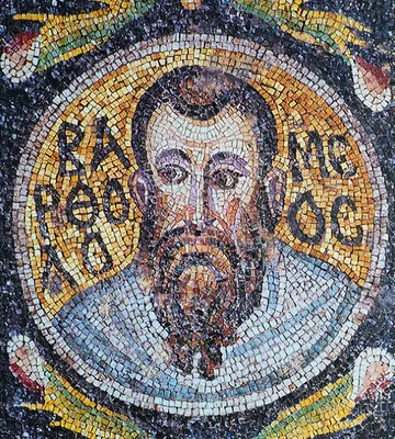 Byzantine mosaic medallion of a bearded apostle with dark hair and large eyes, his name in Greek letters on a gold ground