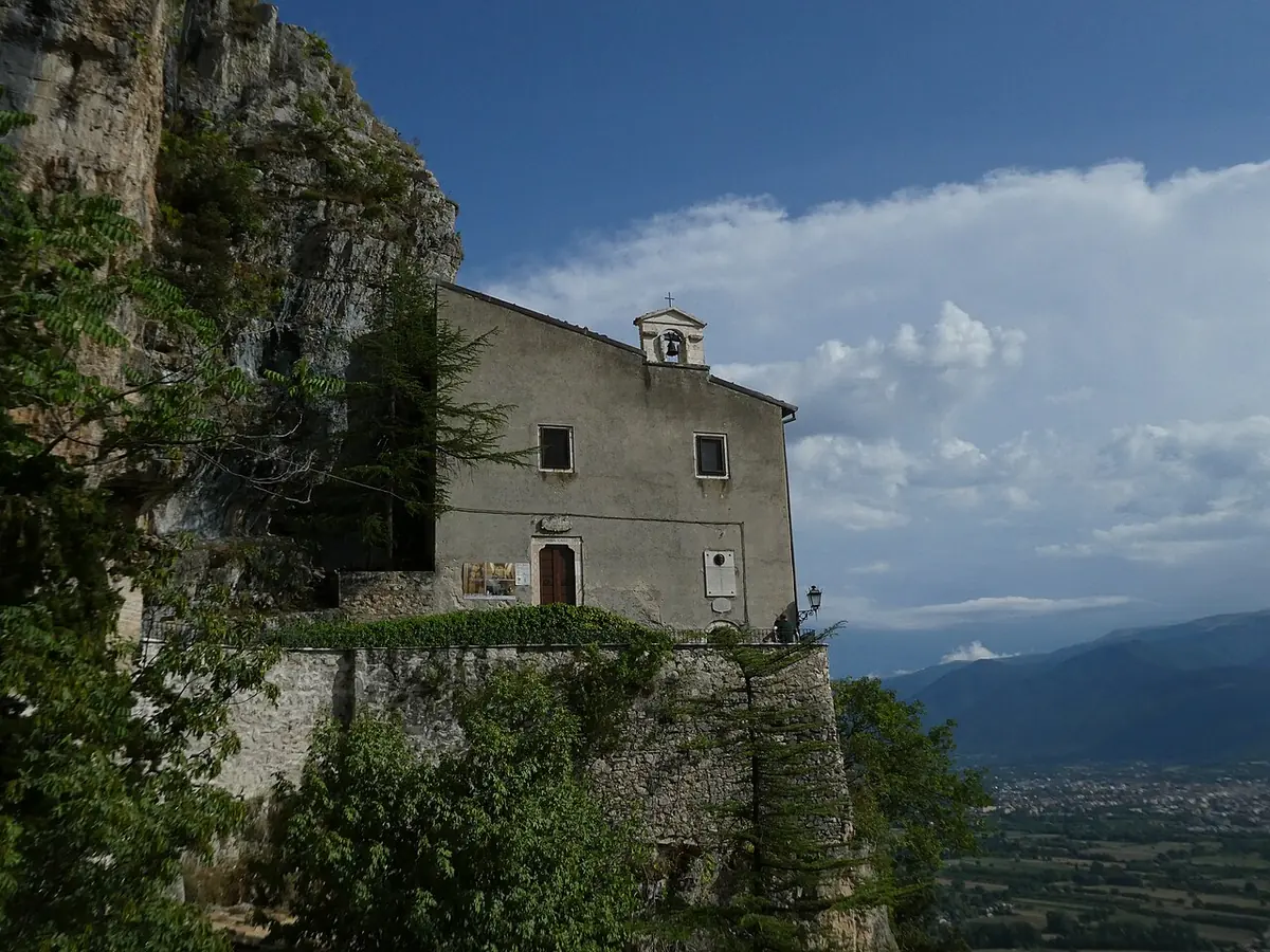The small stone hermitage of Sant'Onofrio built against a cliff on Mount Morrone, with the valley of Sulmona spread out below