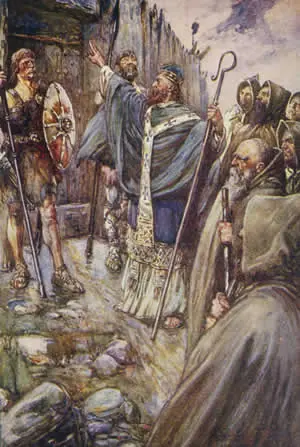 Book illustration of St. Columba in a white robe raising his hand before the closed wooden gate of a fort, with monks behind him and armed Picts watching
