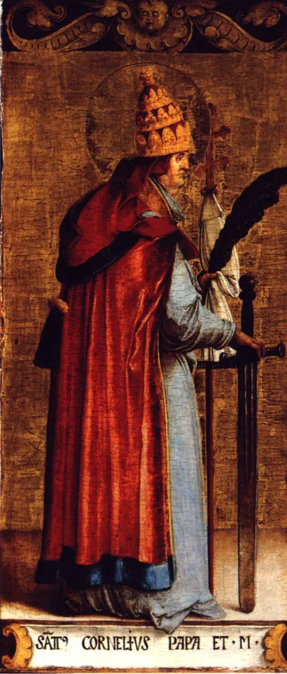 Renaissance panel of a standing pope in a tall gold tiara and a red cope over white, holding a martyr's palm and a sword, with his name painted on a strip at his feet