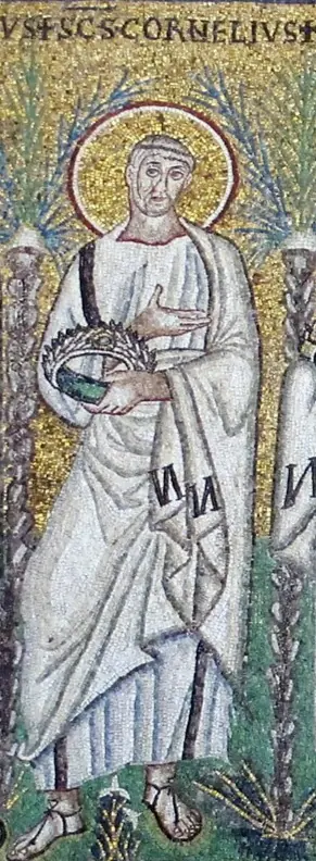 Mosaic of a saint in a white robe on a gold ground, with a halo, holding a jeweled crown in his covered hands, between palm trees and red flowers, with his name above