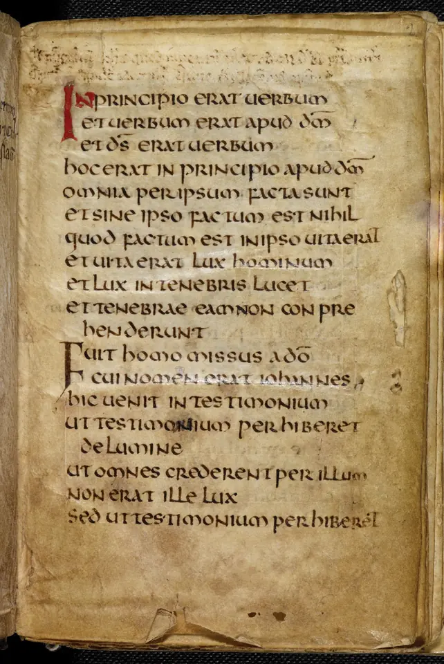 Small parchment page of the Latin Gospel of John written in a clear round hand, the first word marked in red