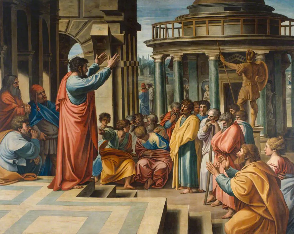 Painting of St. Paul in a red cloak preaching with both arms raised on steps before a crowd of Athenian men, some listening and some arguing, with a round temple and a statue of Mars behind