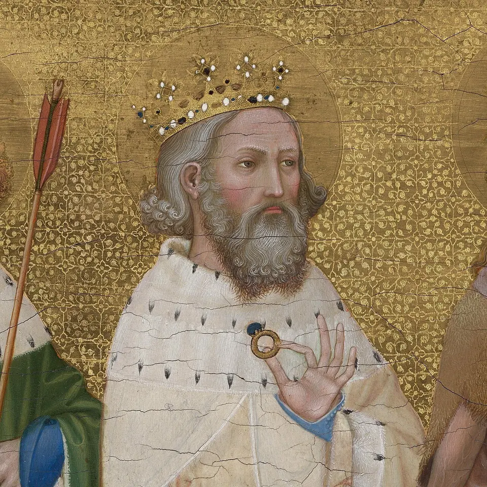Detail of a medieval panel painting of a crowned king with a gray beard and an ermine mantle, holding up a small gold ring between his fingers against a gold patterned background