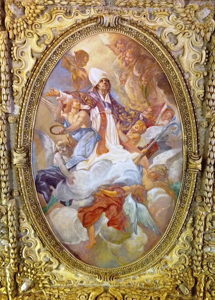 Oval Baroque ceiling fresco in a gilded frame showing St. Erasmus in white bishop's robes carried up into the clouds by angels
