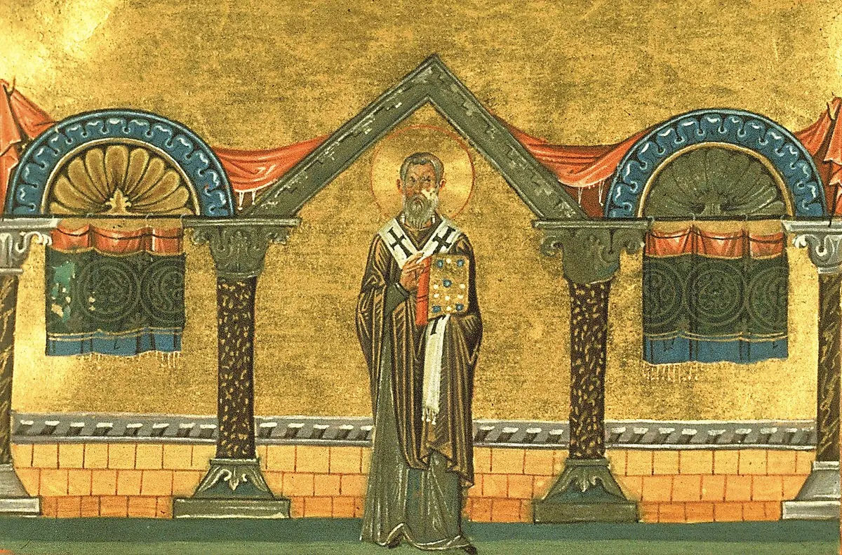 A Byzantine manuscript miniature of a bearded bishop in a white omophorion holding a book, standing on a gold ground between two arched buildings with red curtains