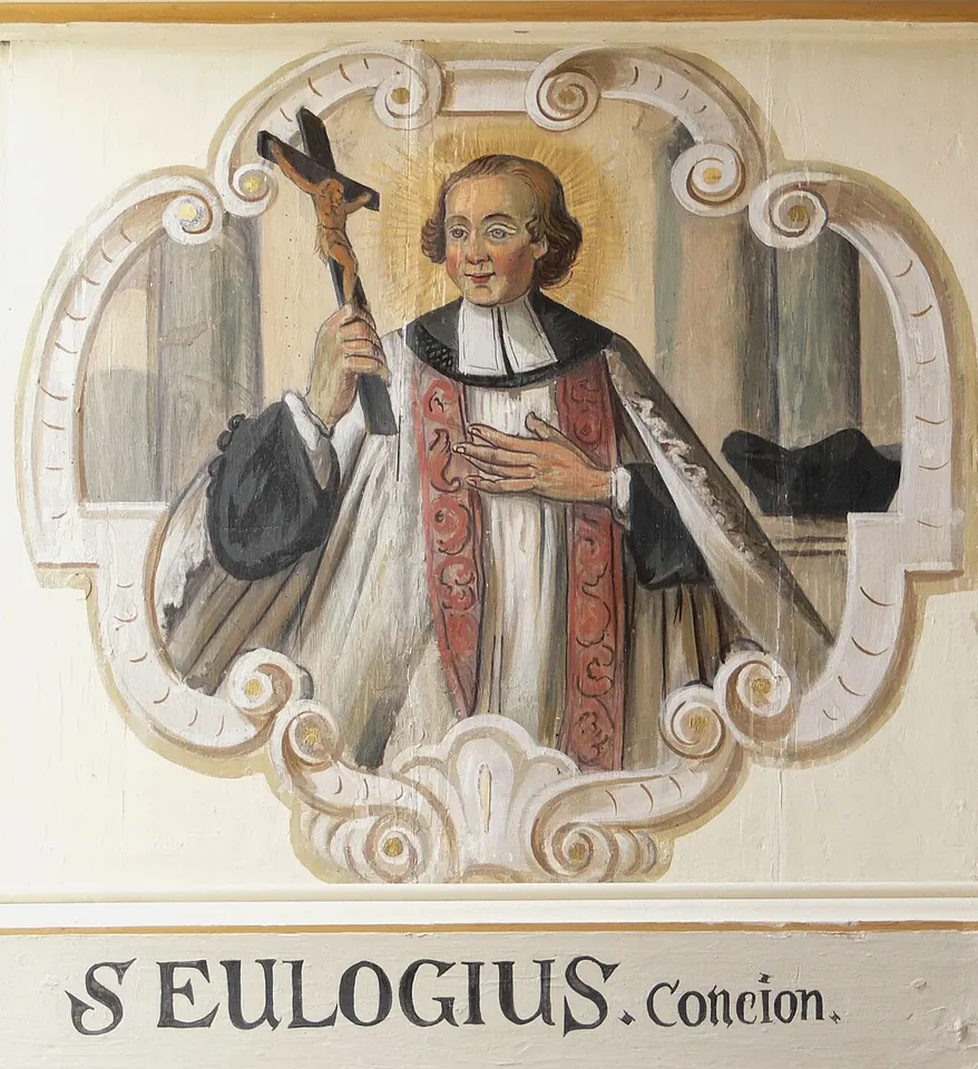 Painted oval medallion of a haloed priest in black with white bands and a red stole, holding a crucifix and pressing a hand to his chest, above a label reading S. Eulogius