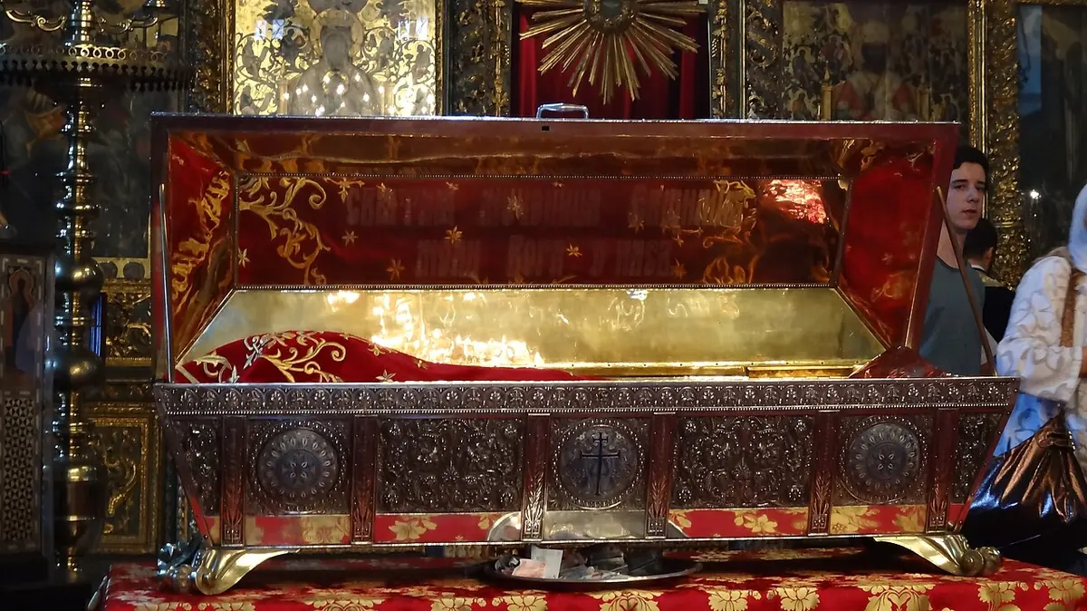 An open silver-gilt reliquary chest lined with red cloth before an icon screen in the Patriarchal Church of St. George, Istanbul, on July 11