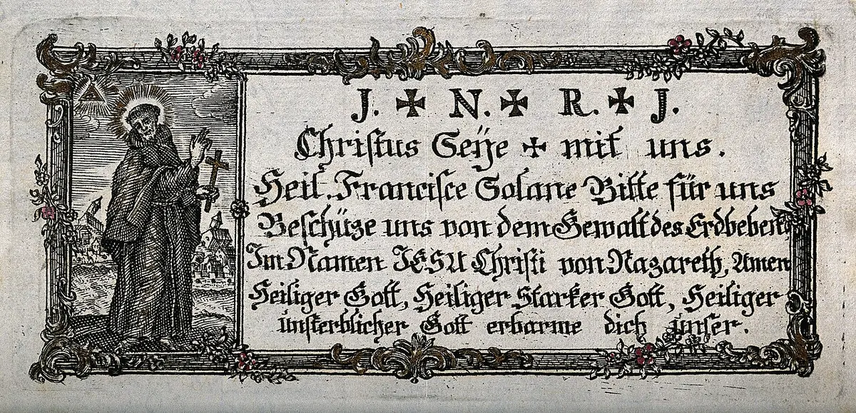 Small colored devotional print with a tiny figure of the friar holding a cross beside a framed German prayer in black lettering