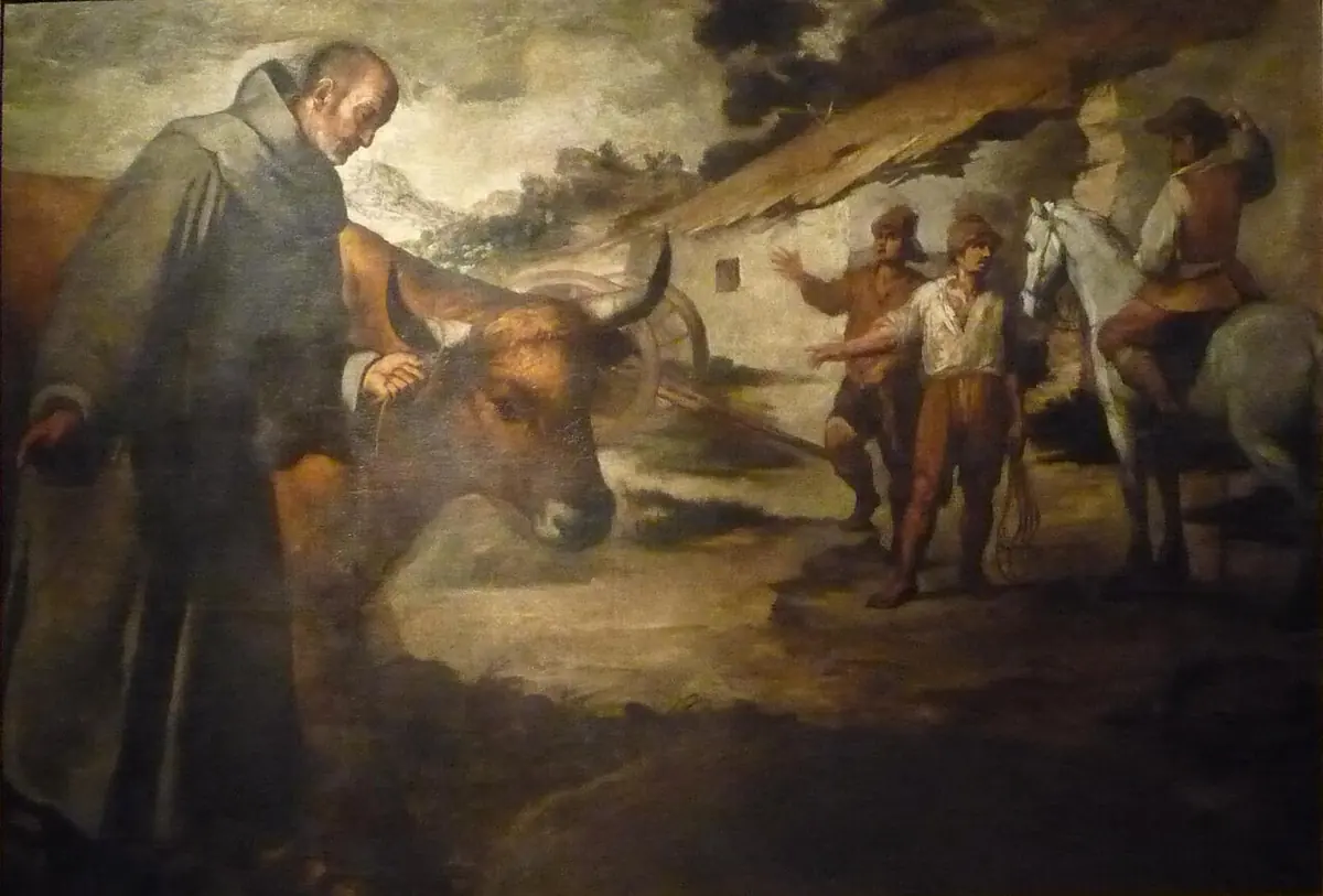 Dark Baroque painting of a friar in a gray habit gently touching the head of a bull, while men on foot and on horseback watch in amazement
