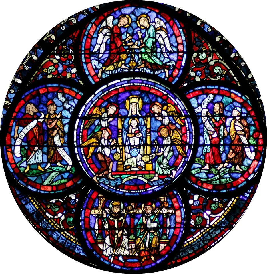 A round stained-glass window in deep blue and red with the Virgin and Child enthroned in the center and two bishops at the bottom, one holding a model of a church