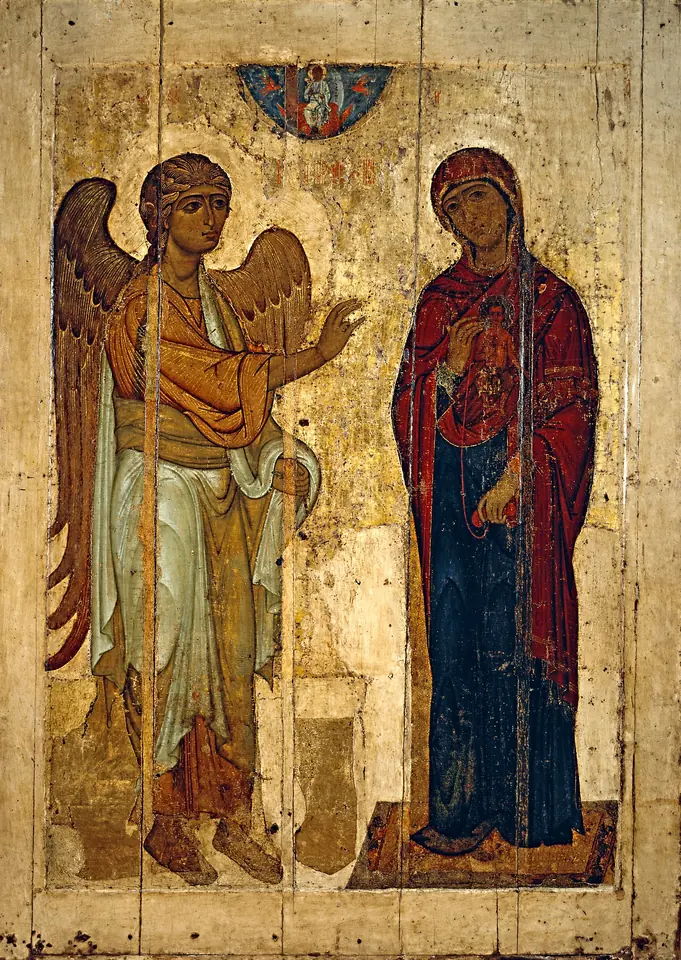 Tall Russian icon of the Archangel Gabriel in pale robes, his hand raised in blessing, facing the standing Virgin in a red mantle, with a small image of the Christ Child on her breast