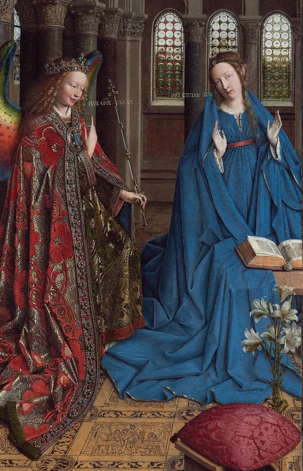 Flemish painting of a smiling angel in a jeweled red and gold cope with peacock-colored wings greeting the Virgin in blue inside a tall Romanesque church, with a vase of lilies between them