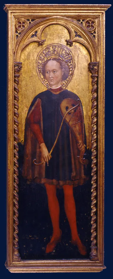 Fifteenth-century Italian panel painting of a young saint with a halo, in a red cloak and red hose, holding a viol and a bow against a dark blue ground in a gilded Gothic frame