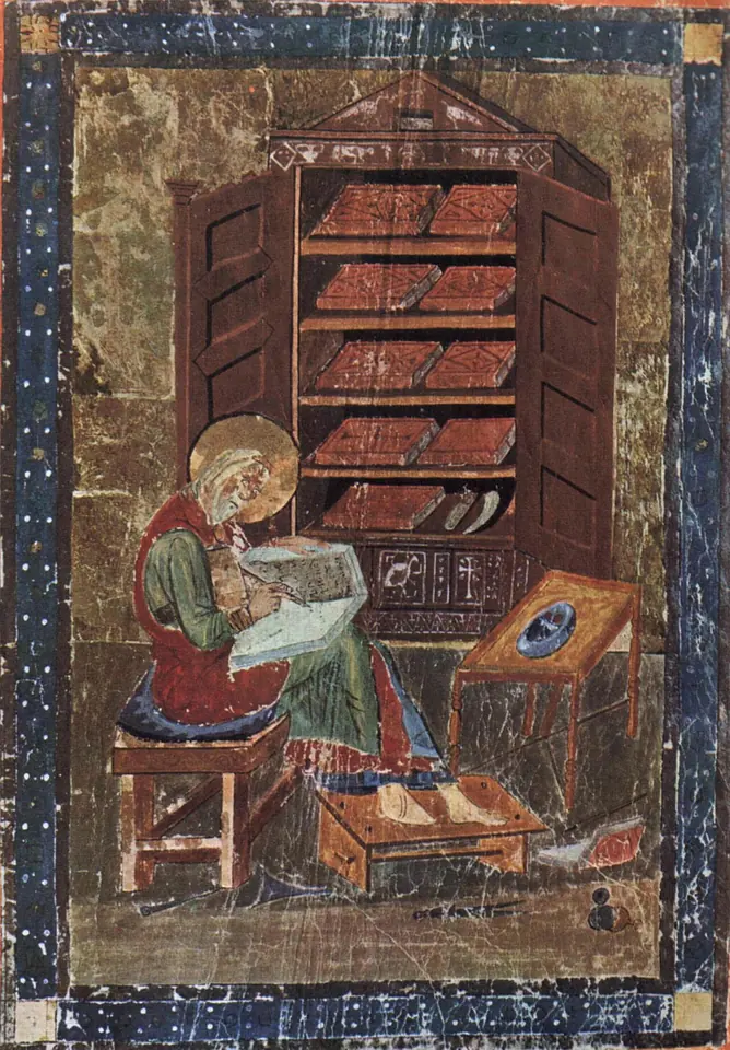Early medieval painting of a haloed scribe seated on a bench writing in a book, with an open book cupboard full of volumes behind him