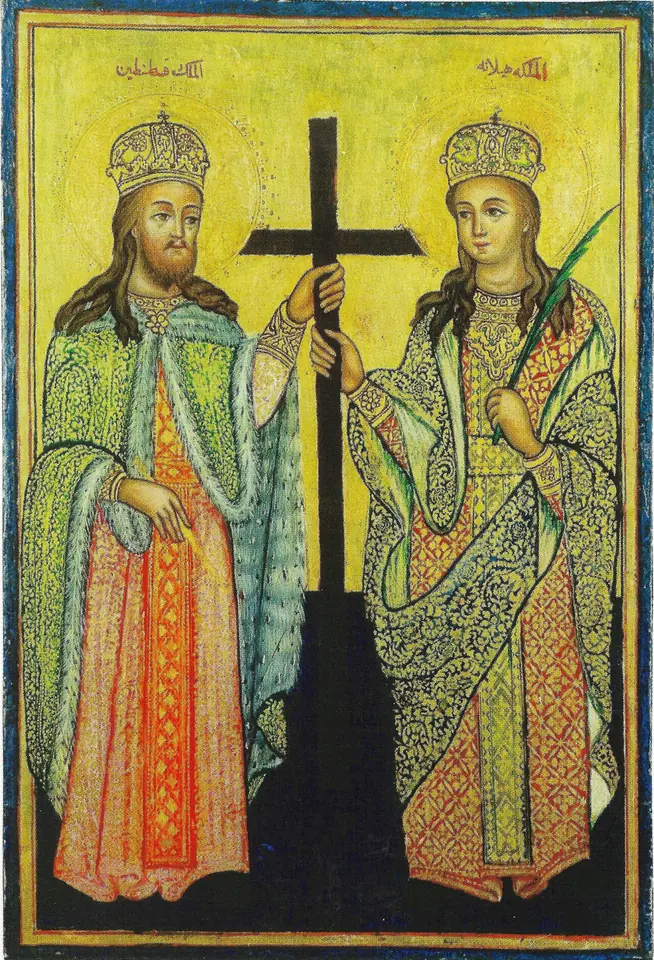 Arabic-inscribed icon of Constantine and Helena in jeweled crowns and patterned robes standing on either side of a tall black cross on a yellow ground