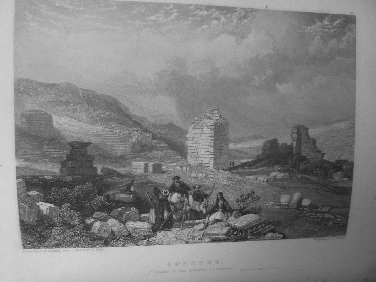 Nineteenth-century engraving of scattered ruins and a lone tower at Ephesus, with travelers and horses in the foreground